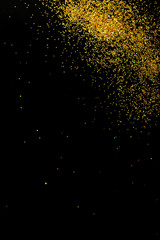 Gold glitter on black background, top view with space for text