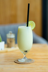 Melon smoothie in glass decoration with slice lemon