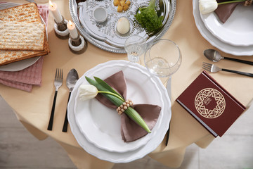 Festive Passover table setting with Torah, top view. Pesach celebration
