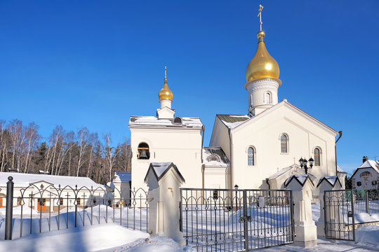 Moscow city historical skyline white winter wonderland street view of orthodox church with golden dome and cross against blue sky cold season landscape background russian winter scene