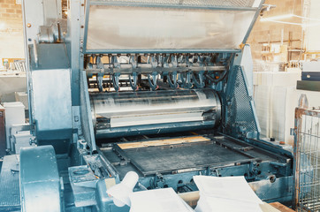 Part of a printing machine for cutting cardboard in printing. Box, production.