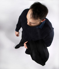 Man with black coat top view