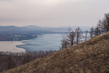 the slope of the mountain diagonally, melting ice on the lake
