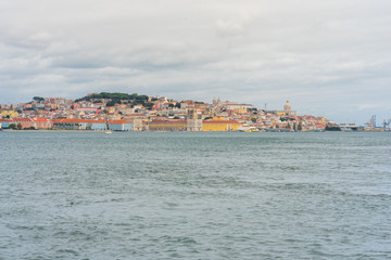 Fototapeta na wymiar Viewpoint over the river to the attractions of Lisbon. The Pombaline, Lower Town, Alfama and the castle over the city