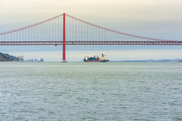 The 25th of April Bridge is connecting the city of Lisbon, capital of Portugal, to the municipality of Almada in the south