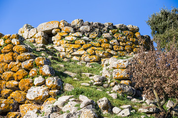 Remains of nuraghe or fortress from the bronze age at Archeological site of Tamuli, Sardinia island, Italy