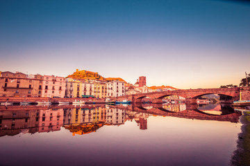 Fototapeta na wymiar Cityscape during sunset of the colorful small town Bosa in Sardinia, Italy