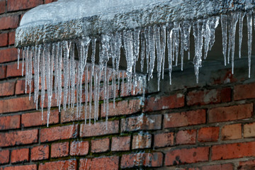 Icicles on the roof on a spring day