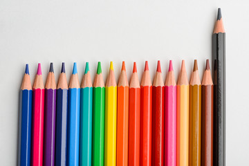 Colored pencils against black