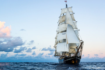 Fototapeta na wymiar German brig roald amundsen sailing on the atlantic at sunset