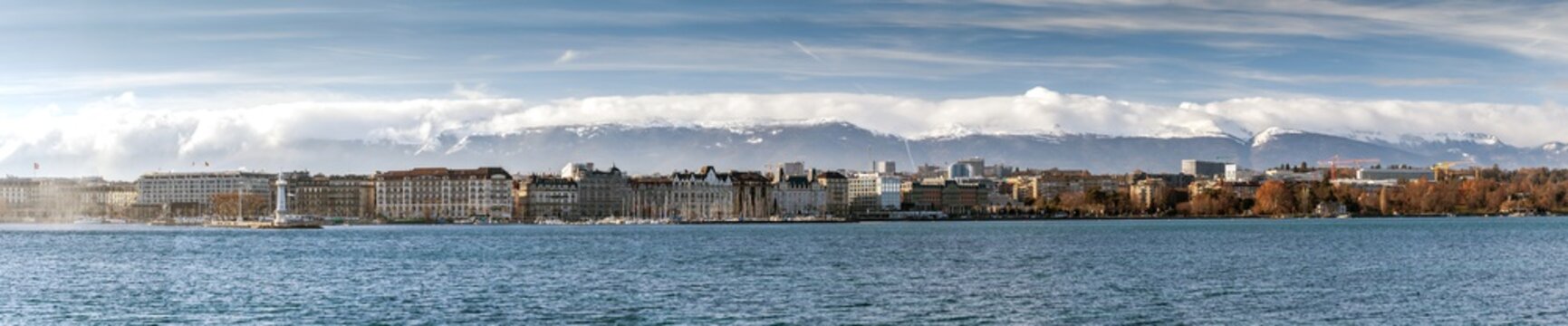 View on Geneva Lake from Quai de Cologny with Phare des Paquis on the left, Geneva, Switzerland, December 2019. Lake on the north side of the Alps, shared between Switzerland and France