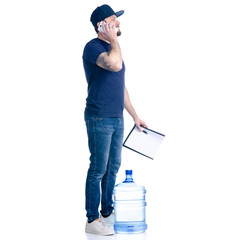Water delivery man in blue t-shirt and cap with smartphone and document invoice signature on white background isolation
