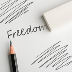 Eraser removing word "Freedom"