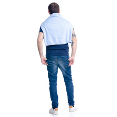 Obraz premium Man in jeans standing on white background isolation, back view