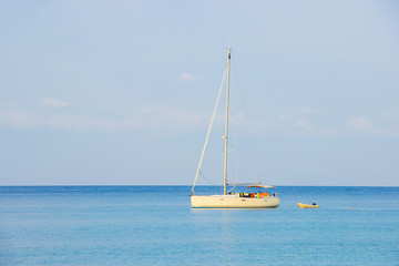 White sailboat of tourist at the background the blue sky on the Ao thai sea area around haad bangbao of koh kood in trat province.Thailand.