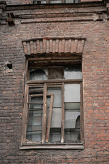 Fototapeta na wymiar old abandoned town, brick buildings with broken Windows