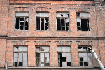 old abandoned town, brick buildings with broken Windows
