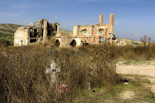 Graffity in a collapsed house in the countryside, mourning the death of a friend.