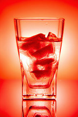 glass of water with ice on white background