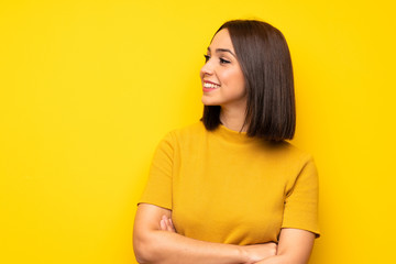 Portrait of young woman over white wall