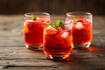 Fresh summer cocktail with ice, strawberry and mint