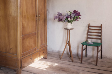 lilac in jug on old vintage interior
