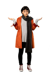 A full-length shot of a Short hair woman with coat unhappy because not understand something over isolated white background