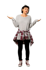 A full-length shot of a Young woman with short hair unhappy because not understand something over isolated white background