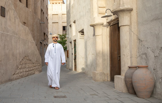 Arab Man walking in old Al Seef area of Dubai