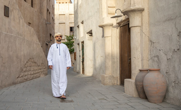 Arab Man walking in old Al Seef area of Dubai