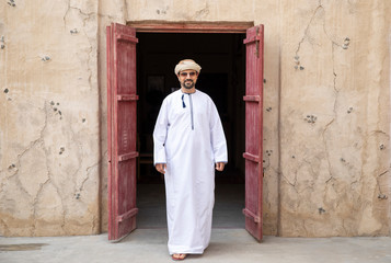Arab Man walking in old Al Seef area of Dubai
