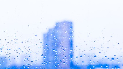 City. Drops in window