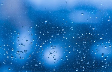 City. Drops in window