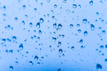 City. Drops in window