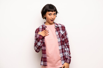 Young woman with short hair surprised and shocked while looking right