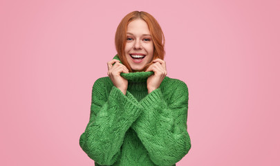 Bright happy girl in green sweater