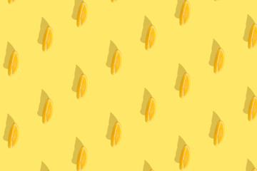 Oranges on bright colored yellow background. Repeating pattern, preparation for wallpaper citrus mood.