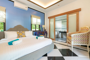 Luxury real Interior design in bedroom of pool villa with cozy king bed. with high raised ceiling  home, house ,building