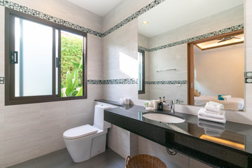 Luxury beautiful interior real bathroom features basin, toilet bowl in the house or home building