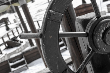 old ship wheel, black and white photo