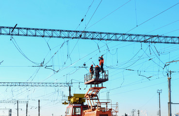 Special train with a landing crane for service and repair of electrical networks on the railway....