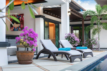 home or house exterior and interior design with beautiful sun bed of pool villa 