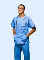 Surgeon doctor man with glasses and happy on isolated background