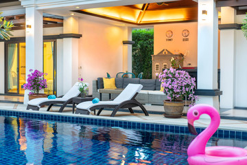 home or house exterior and interior design with beautiful sun bed of pool villa 