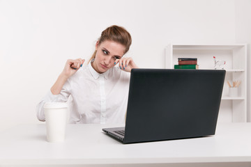 Tired businesswoman holding eyeglasses. Girl feeling discomfort from long wearing glasses at workplace. Exhausted female office worker gather herself for completing work