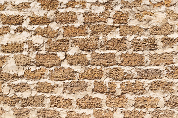 wall of yellow shell rock blocks, natural stone, textural background