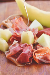 traditional Italian appetizer of prosciutto and melon. selective focus and copy space