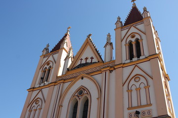 orange church on blue sky 