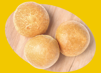 Whole grain buns isolated on yellow  background.