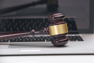 gavel on white laptop. Concept -online Auction